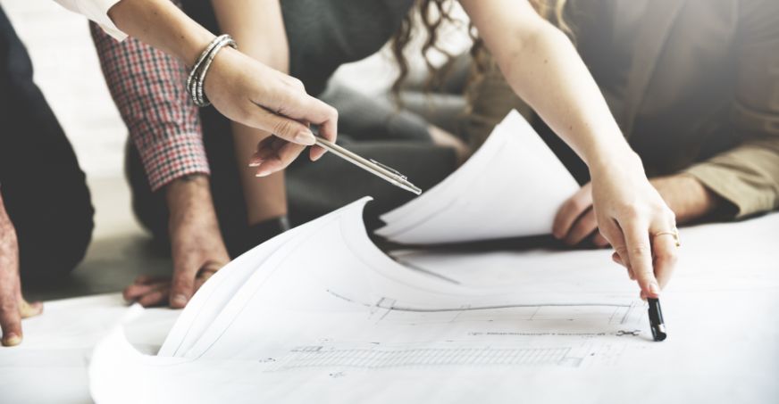 Group of people editing designs